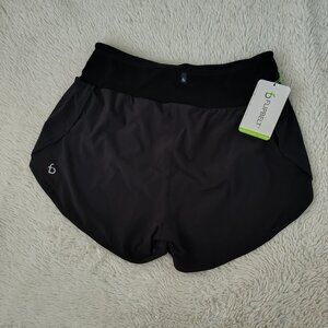 NWT Women’s FlipBelt running shorts in L, brand‑new with tags